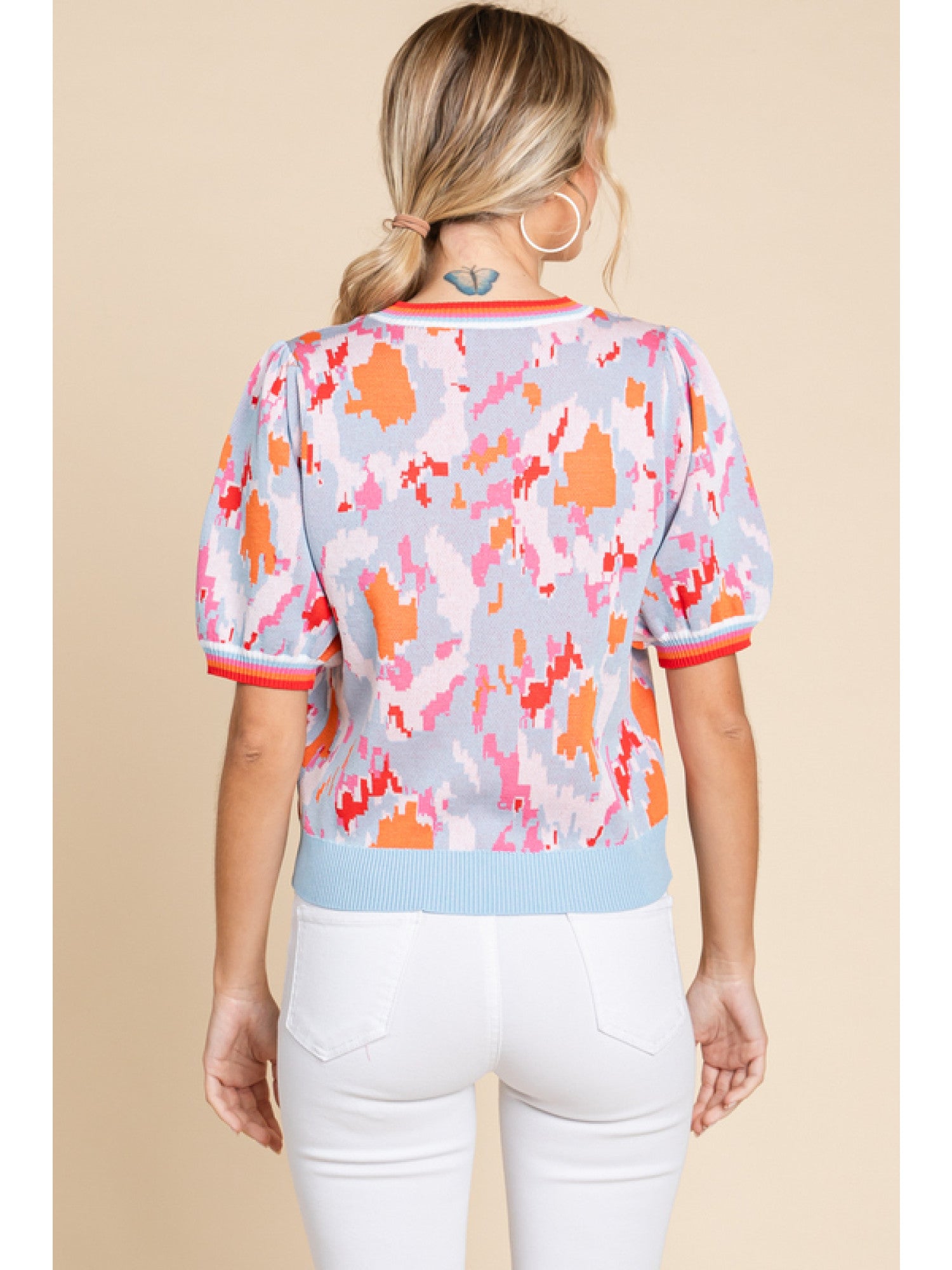 - Print knit top with a U-neck, short bubble sleeves, stretch-band cuffs and striped.
- non-sheer, lightweight.