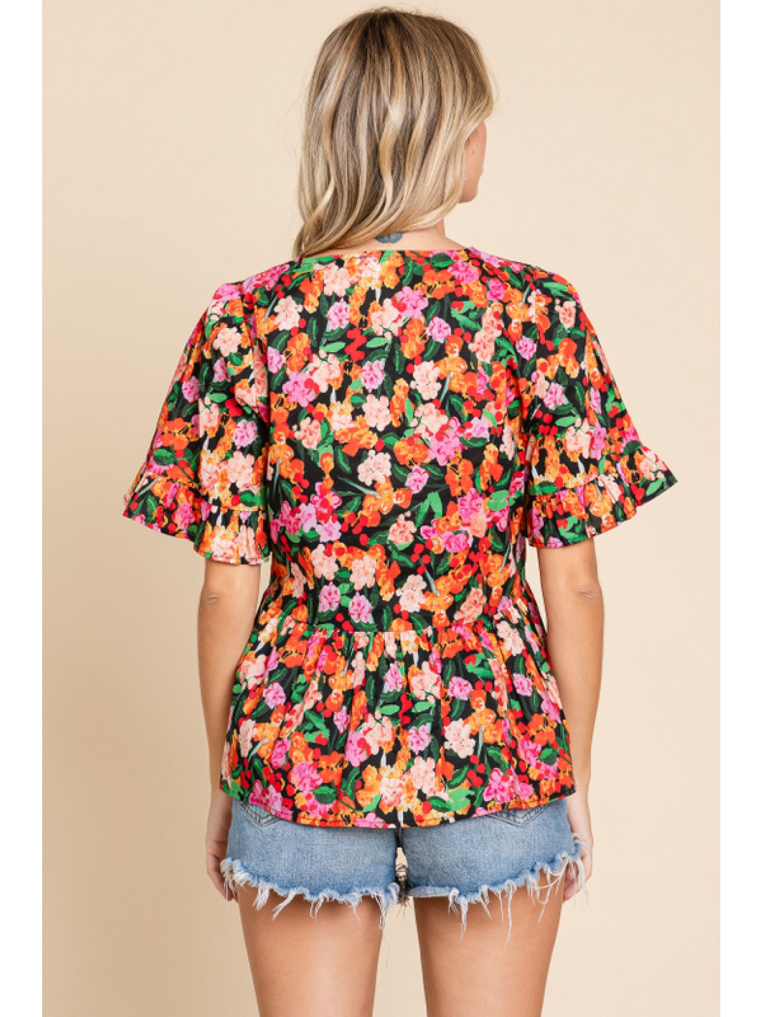 - Black Floral print peplum top with a V-neck, short sleeves, and frilled cuffs.
- Unlined, non-sheer, lightweight.