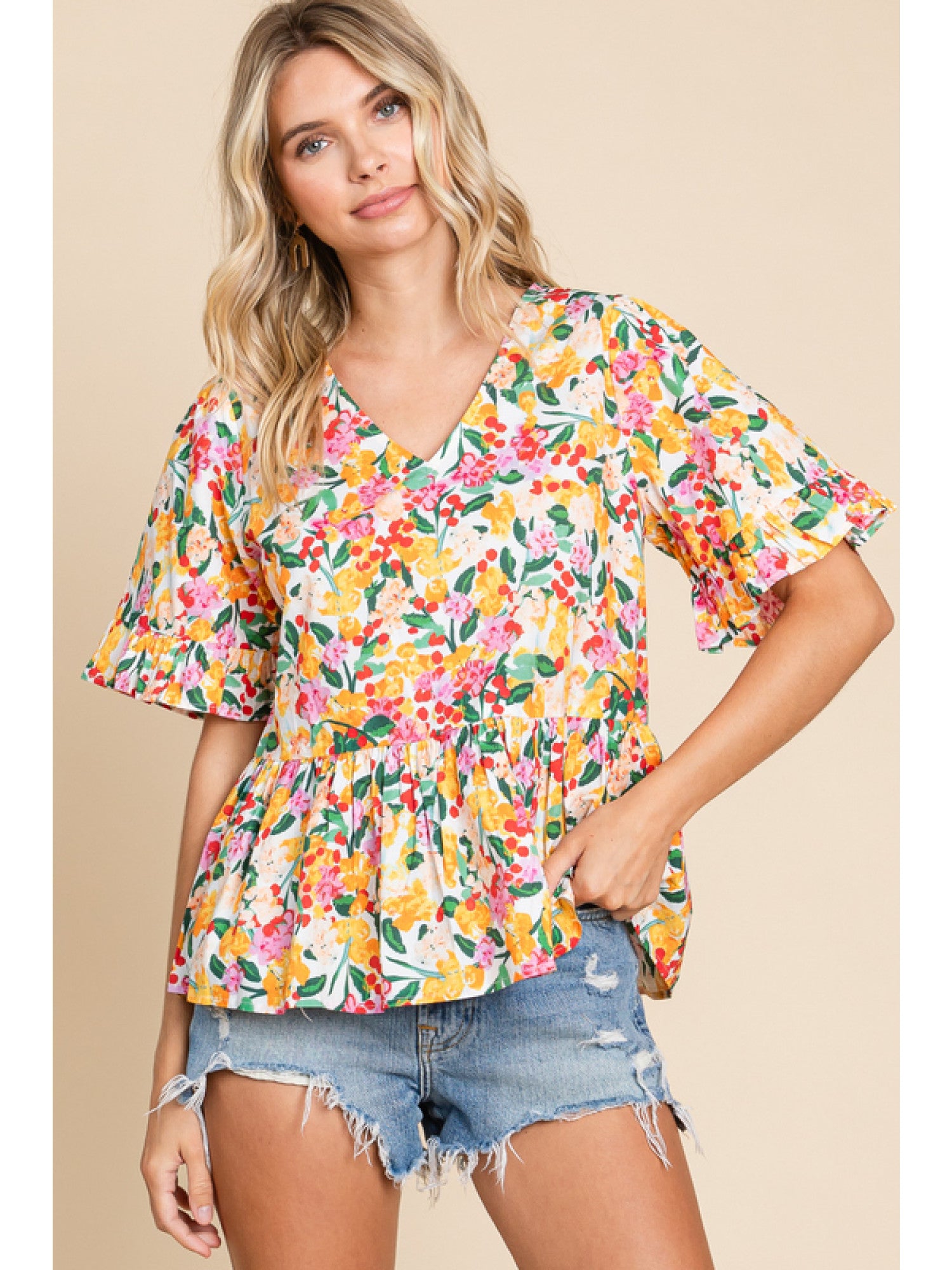 - Off Whie Floral print peplum top with a V-neck, short sleeves, and frilled cuffs.
- Unlined, non-sheer, lightweight.