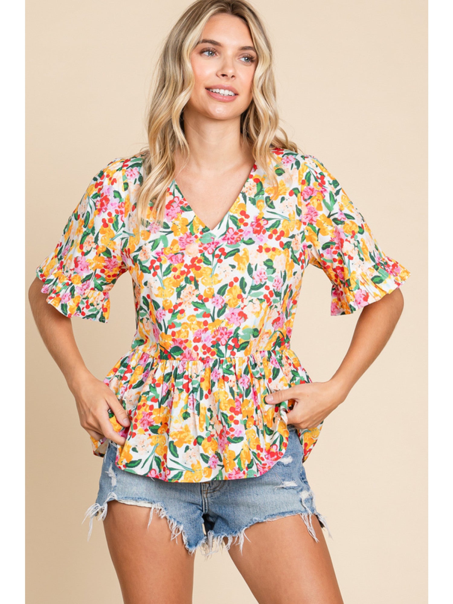 - Off Whie Floral print peplum top with a V-neck, short sleeves, and frilled cuffs.
- Unlined, non-sheer, lightweight.