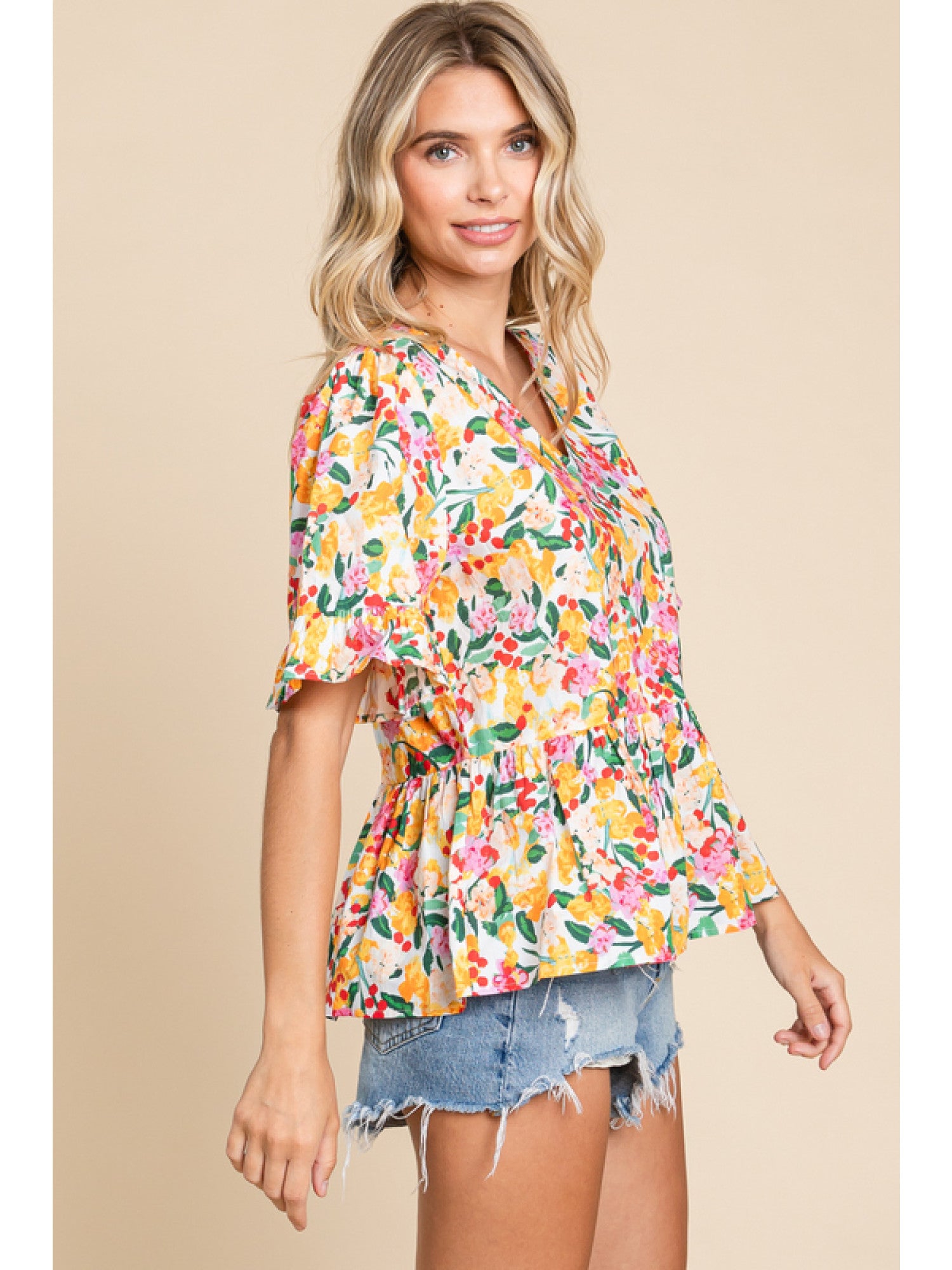 - Off Whie Floral print peplum top with a V-neck, short sleeves, and frilled cuffs.
- Unlined, non-sheer, lightweight.