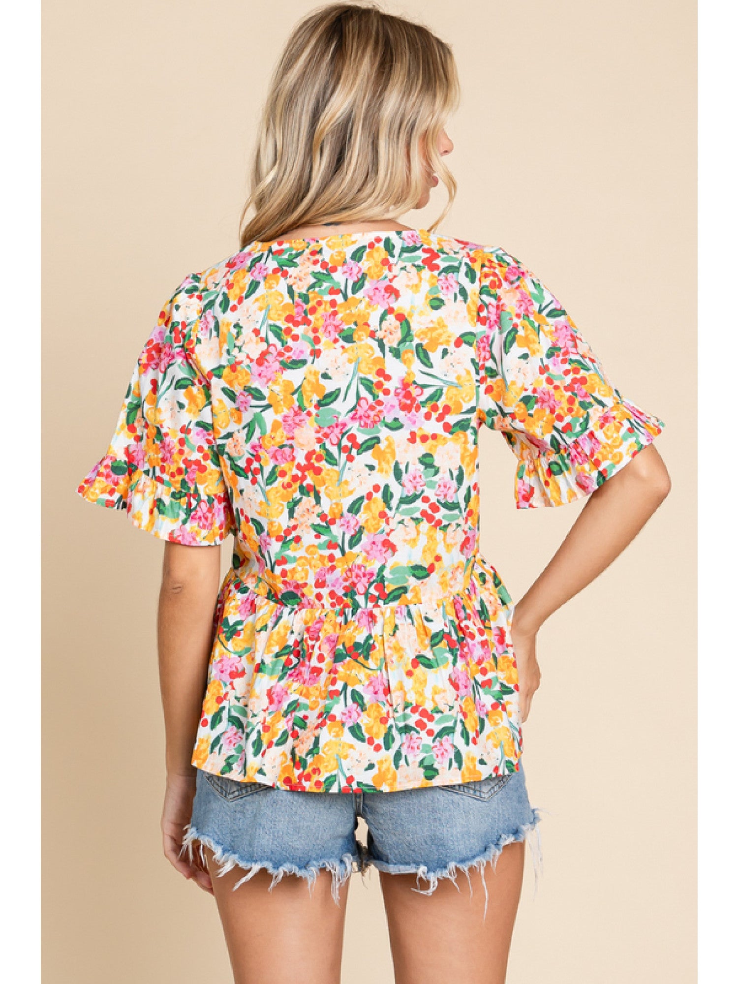 - Off Whie Floral print peplum top with a V-neck, short sleeves, and frilled cuffs.
- Unlined, non-sheer, lightweight.