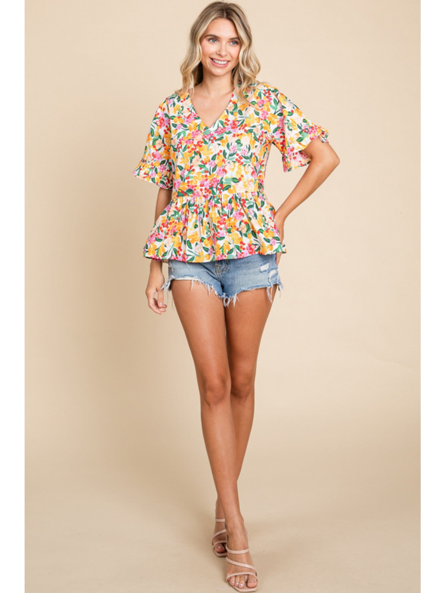- Off Whie Floral print peplum top with a V-neck, short sleeves, and frilled cuffs.
- Unlined, non-sheer, lightweight.
