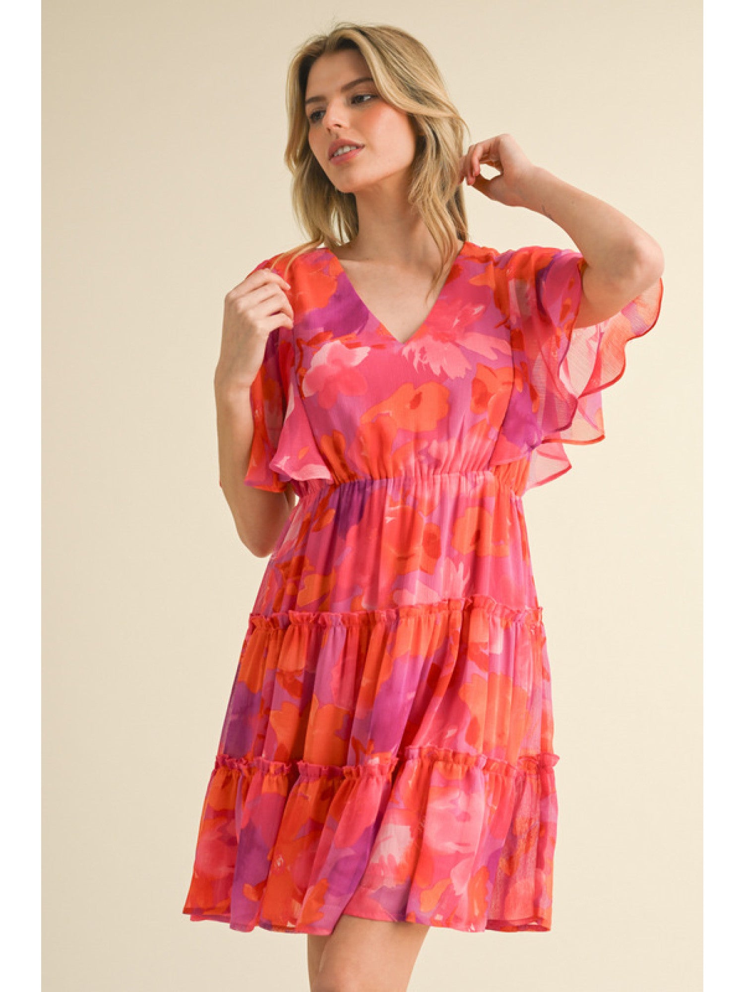 - Fuchsia, Orange and Purple floral print chiffon dress with a V-neck, short bell sleeves, and frilled tiered skirt.
- Lined, non-sheer, lightweight.