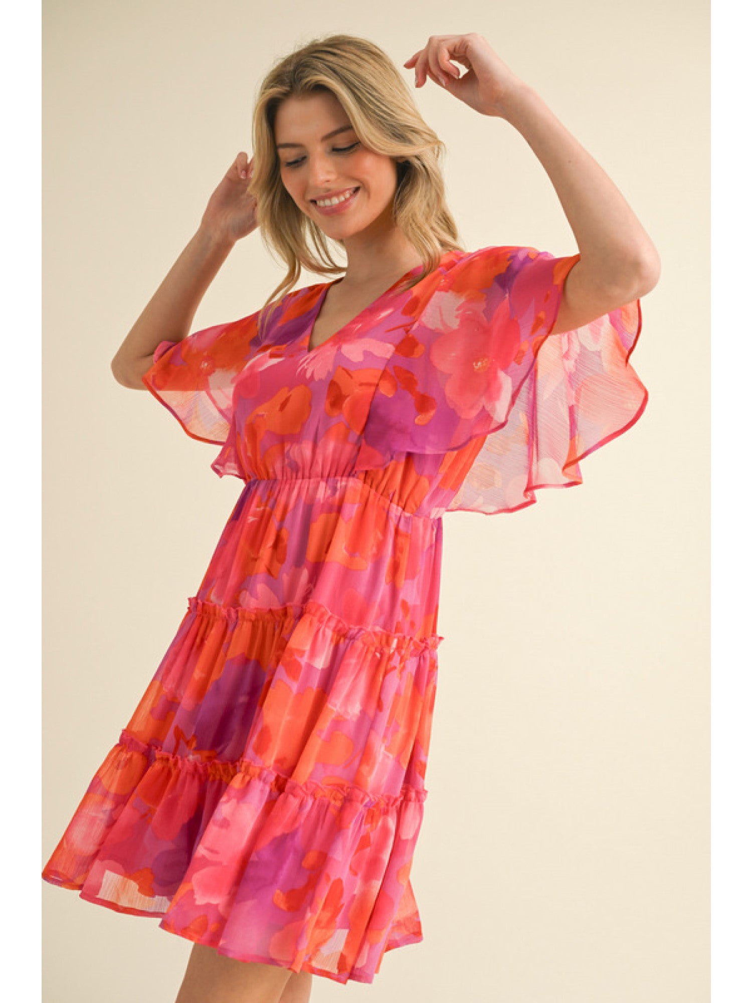 - Fuchsia, Orange and Purple floral print chiffon dress with a V-neck, short bell sleeves, and frilled tiered skirt.
- Lined, non-sheer, lightweight.