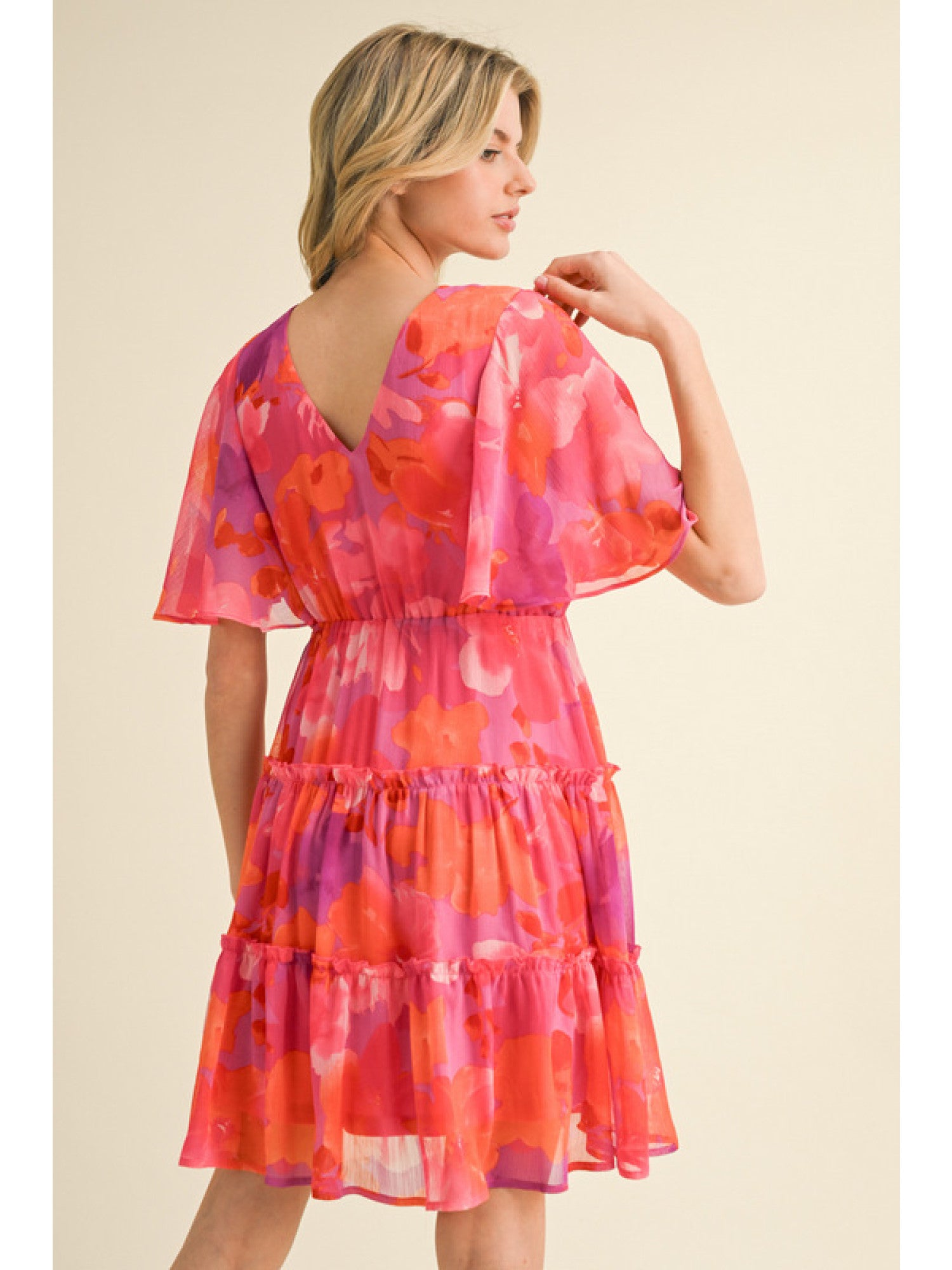 - Fuchsia, Orange and Purple floral print chiffon dress with a V-neck, short bell sleeves, and frilled tiered skirt.
- Lined, non-sheer, lightweight.