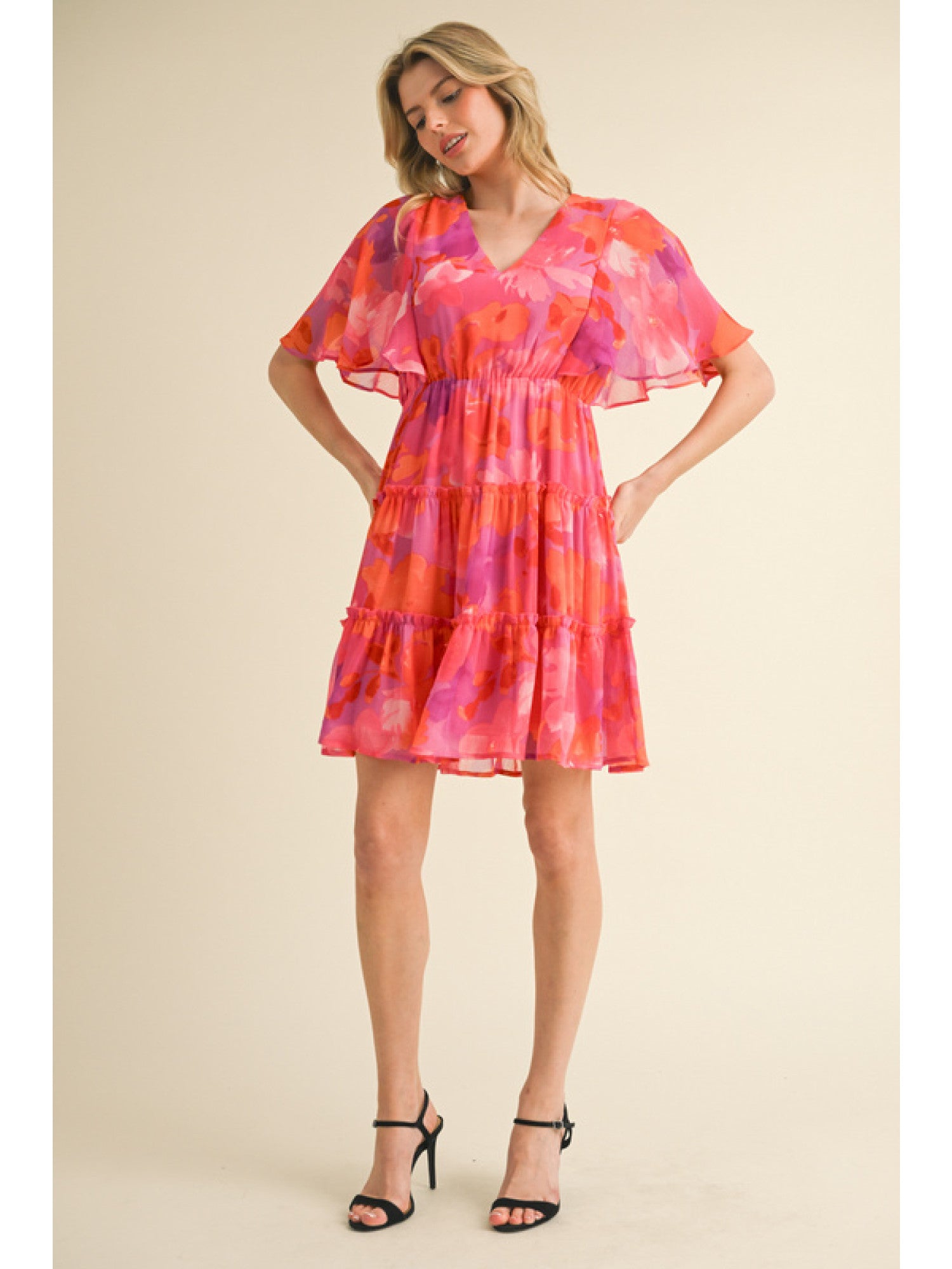 - Fuchsia, Orange and Purple floral print chiffon dress with a V-neck, short bell sleeves, and frilled tiered skirt.
- Lined, non-sheer, lightweight.