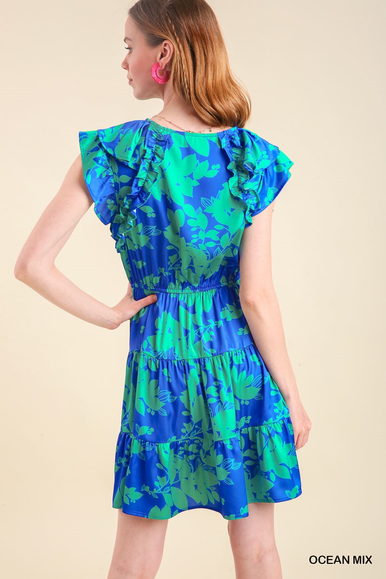 Women's blue and green floral tiered dress with stretch waist and short flutter sleeve.