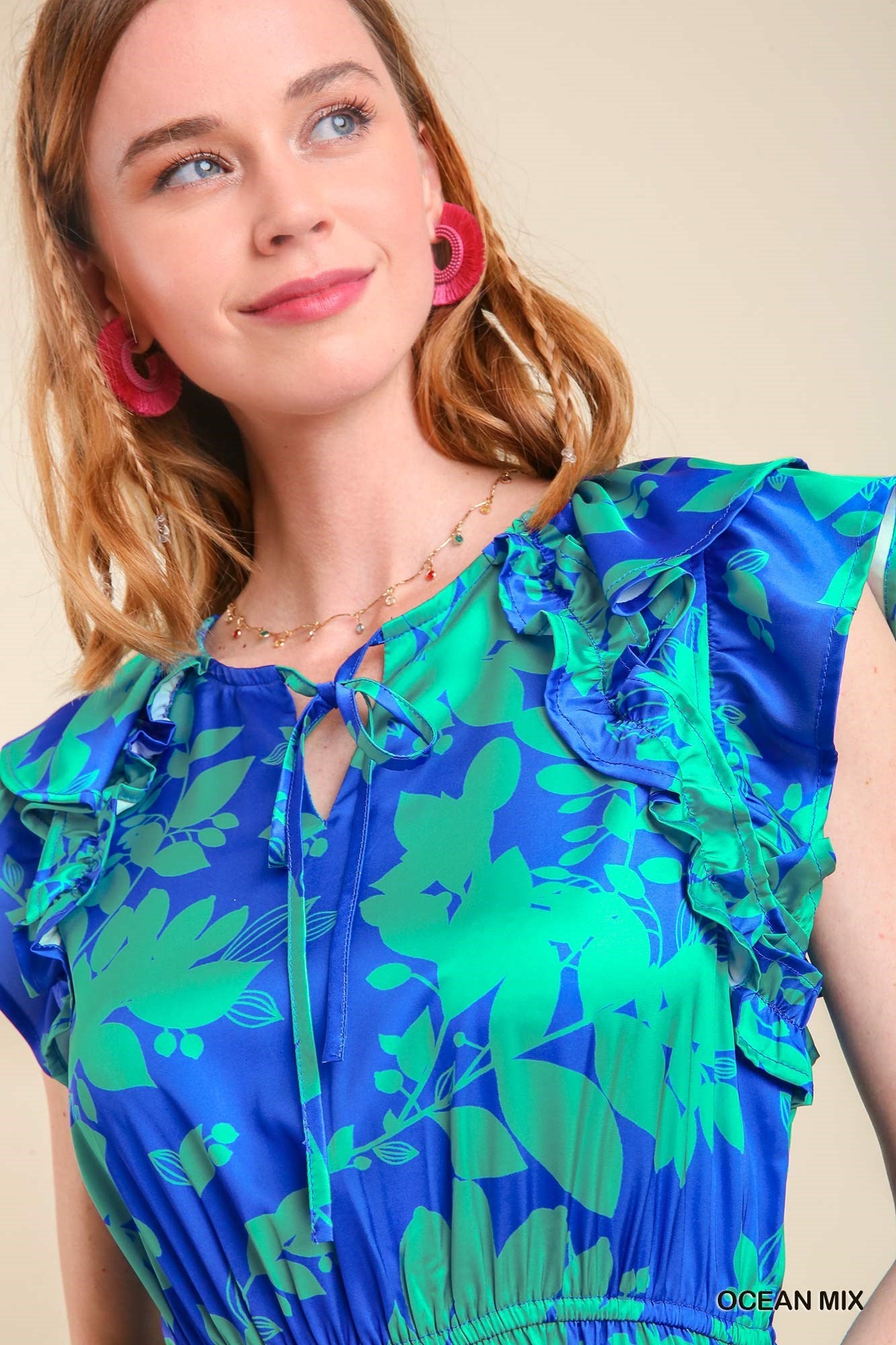 Women's blue and green floral tiered dress with stretch waist and short flutter sleeve.