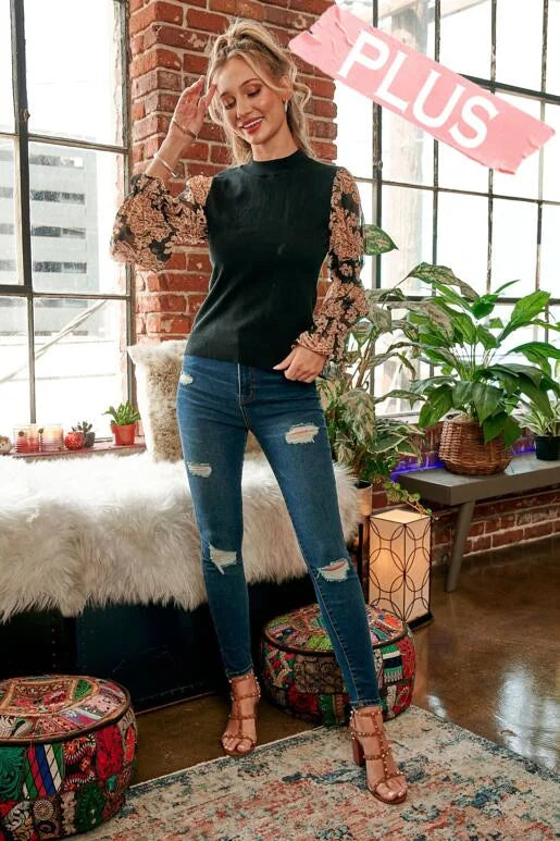 Simple Elegance Curvy Size Black Jacquard Organza sleeve and sweater mixed top, with round neckline and elastic arm bands. Wear with sleeves down or pull sleeves up to elbow for a bell sleeve look.