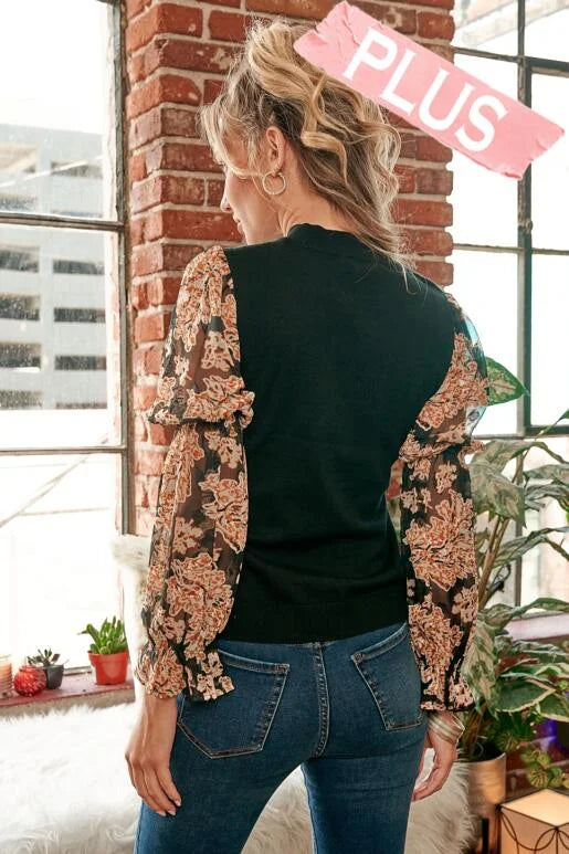 Simple Elegance Curvy Size Black Jacquard Organza sleeve and sweater mixed top, with round neckline and elastic arm bands. Wear with sleeves down or pull sleeves up to elbow for a bell sleeve look.