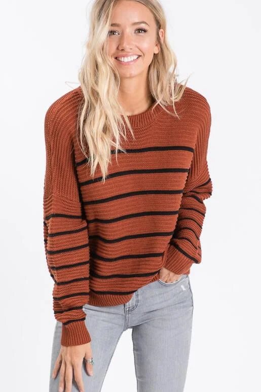 Fall Vibes Rust and Black Striped Sweater with Zigzag ribbed knit pattern.
Color: Rust
Super soft casual and slightly oversized for a slouchy fit with a shorter length.