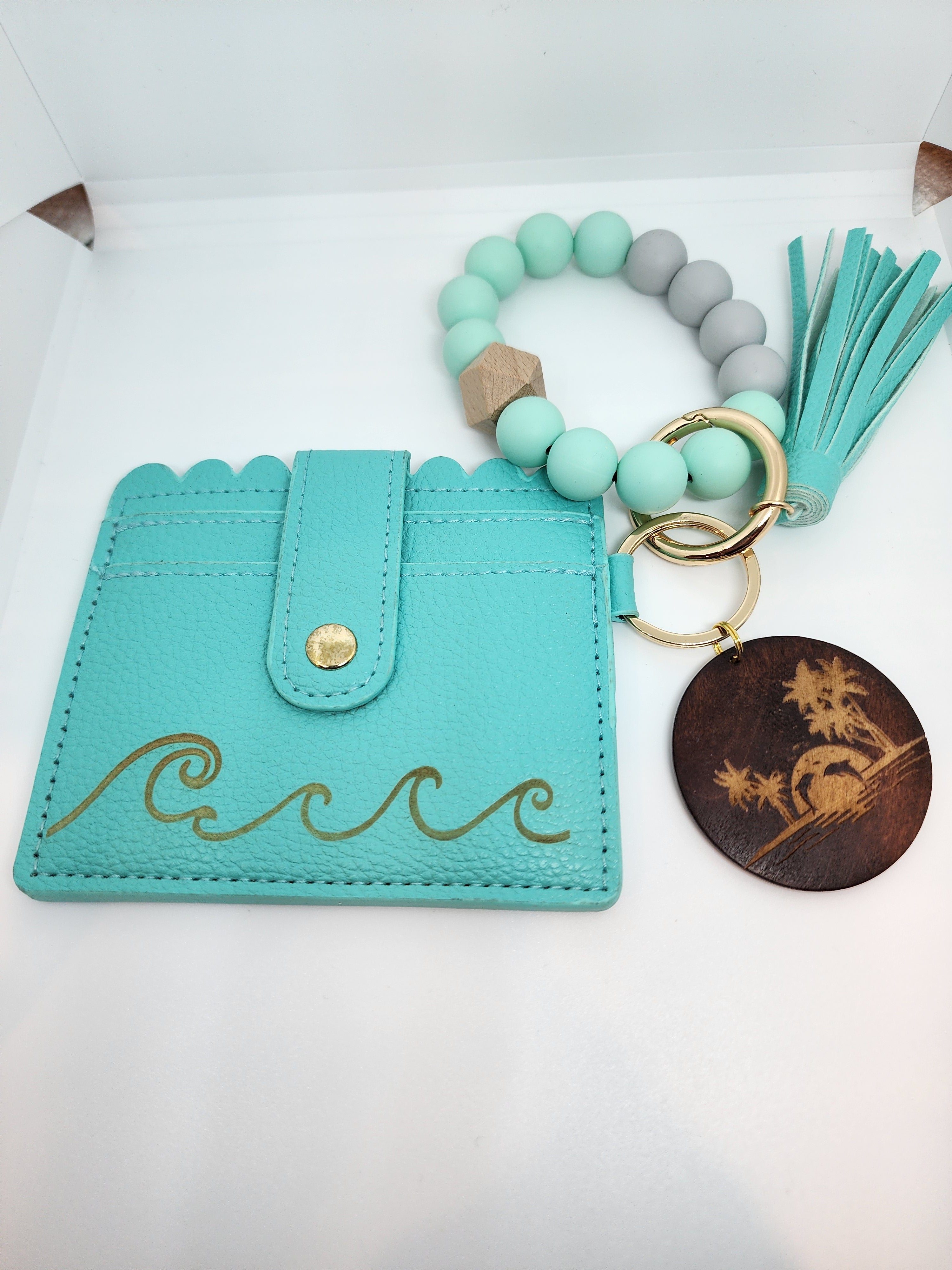 Turquoise beaded wristlet keychain with tassel and credit card holder.