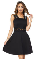 A short black dress with lace sleeves and waist pockets, featuring sequin accents on the front of the sleeves.