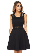 A short black dress with lace sleeves and waist pockets, featuring sequin accents on the front of the sleeves.