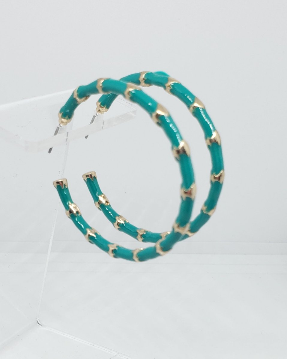 Lightweight Acrylic Resin Green and Gold Hoop Earrings.

Approximate Length: 1.75"