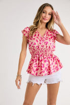 Pink Valentine mood Leopard satin top with V-neck and smocked waist. and Ruffle Sleeves.