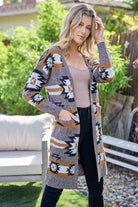 Aztec Southwestern Pattern Long Cardigan:

- Heavy weight and warm
- Open front cardigan with front pockets
- Colors: Black, Ivory, Brown