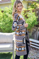 Aztec Southwestern Pattern Long Cardigan:

- Heavy weight and warm
- Open front cardigan with front pockets
- Colors: Black, Ivory, Brown