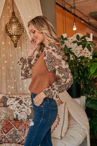 Camel Brown Jacquard organza sleeve and sweater mixed top, with round neckline and elastic arm bands. Wear with sleeves down or pull sleeves up to elbow for a bell sleeve look.