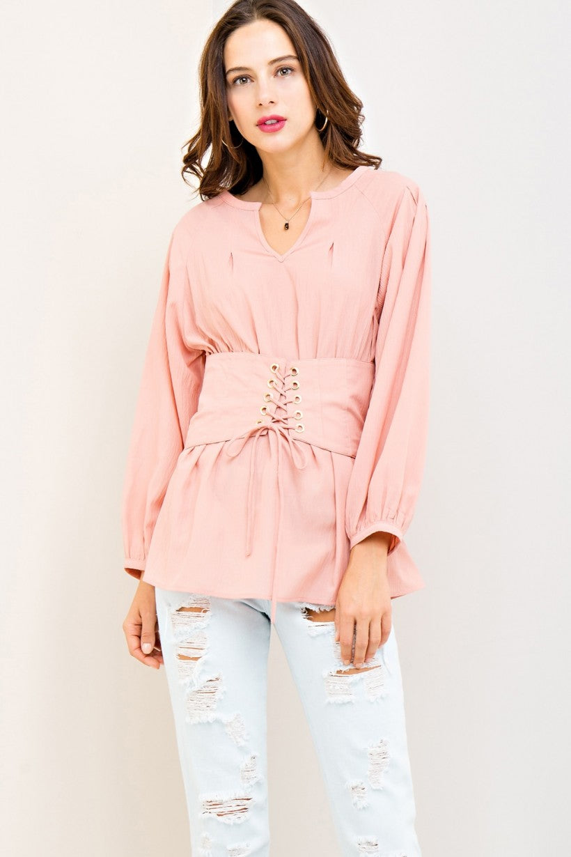 Long Sleeve Fitted Top with Tie Front and Elastic Waist on Back. Color Blush Pink.