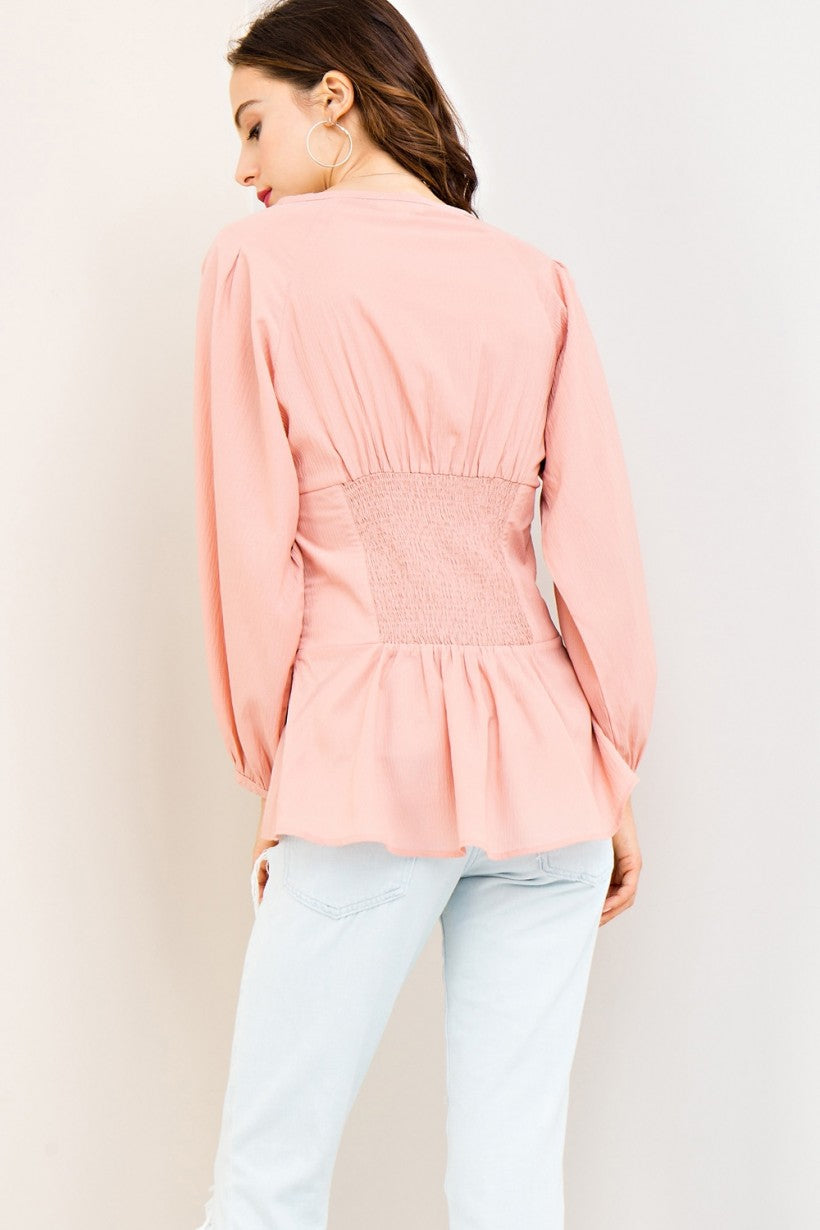 Long Sleeve Fitted Top with Tie Front and Elastic Waist on Back. Color Blush Pink.