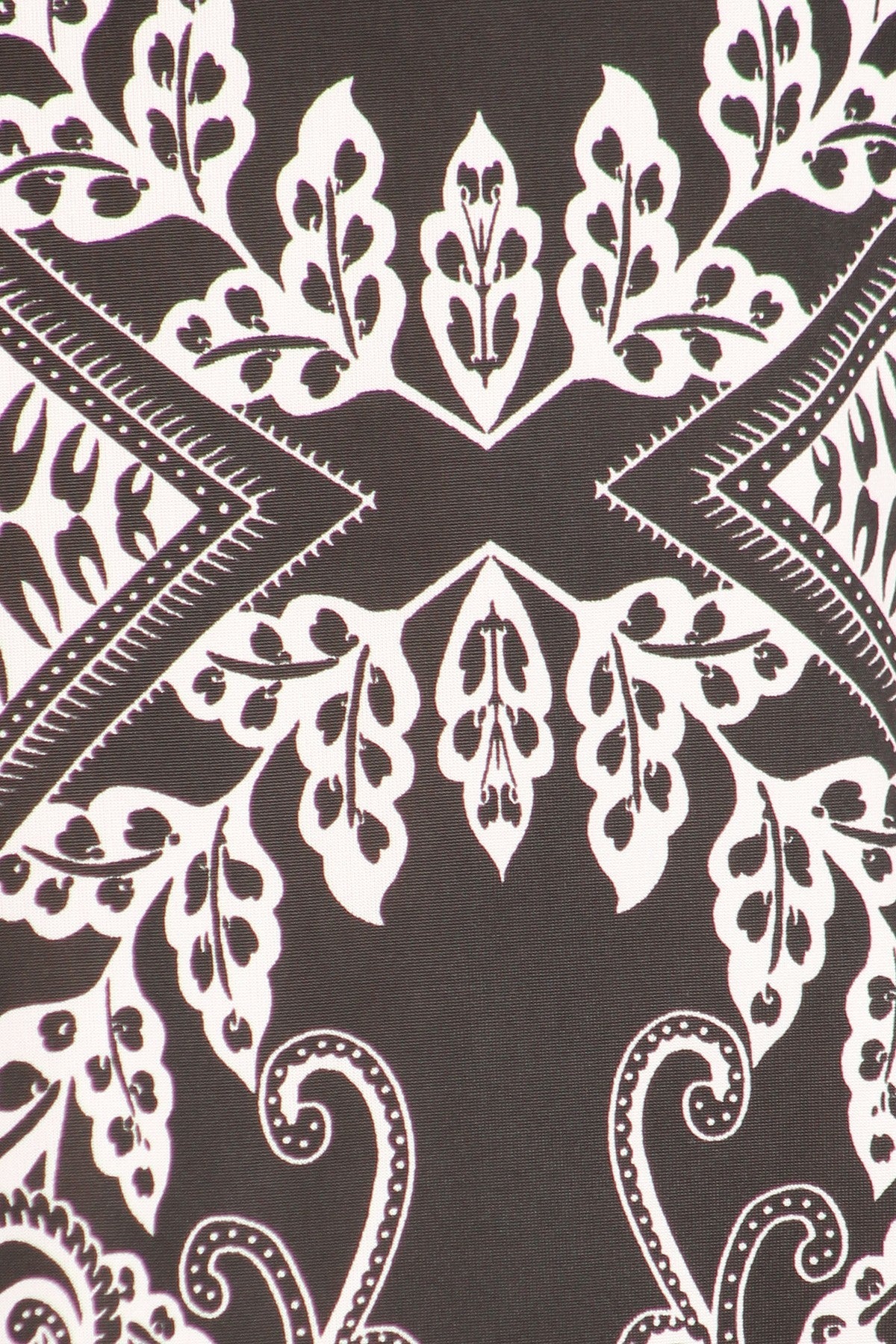 Black and white printed tunic top in a relaxed fit with a round neck, short sleeves, side ruched detail, and curved hi-low hem, in Plus Sizes.