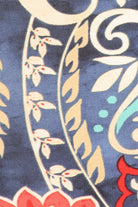 Blue, Coral, Turquoise and Off-White are most of the colors featured in this fun, curvy sized abstract print, waist length top in a relaxed fit, with flutter 3/4 sleeves, a crew neck, and asymmetric hem.