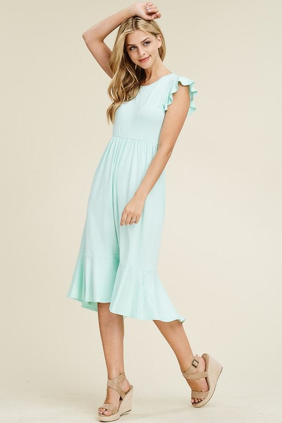 Solid dress featuring ruffled cap sleeve, causal mermaid hem detailing at the bottom skirt

Colors: Magenta, Black, Mint