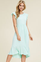 Solid dress featuring ruffled cap sleeve, causal mermaid hem detailing at the bottom skirt

Colors: Magenta, Black, Mint