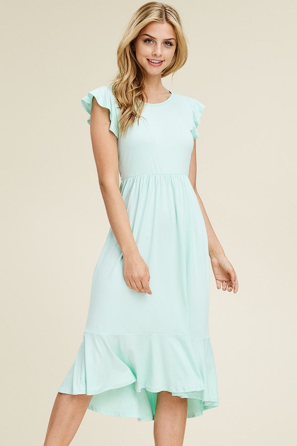 Solid dress featuring ruffled cap sleeve, causal mermaid hem detailing at the bottom skirt

Colors: Magenta, Black, Mint