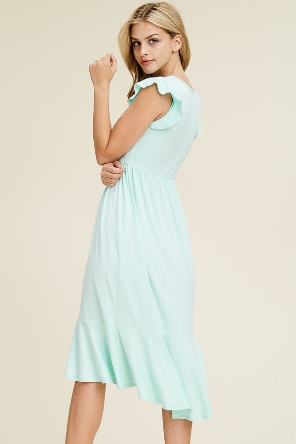 Solid dress featuring ruffled cap sleeve, causal mermaid hem detailing at the bottom skirt

Colors: Magenta, Black, Mint