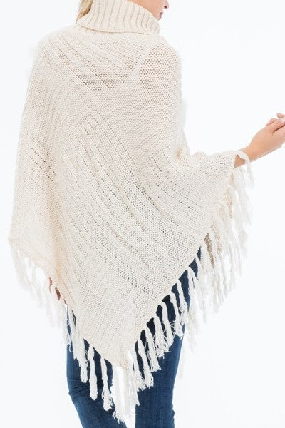 Cream Hand Made Knitted with Fur Accent Luxury Turtleneck Poncho, with tassel fringe trim.