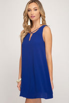 Royal Blue Sleeveless Lined Short Dress with Crisscross Neck Detail, midi length.