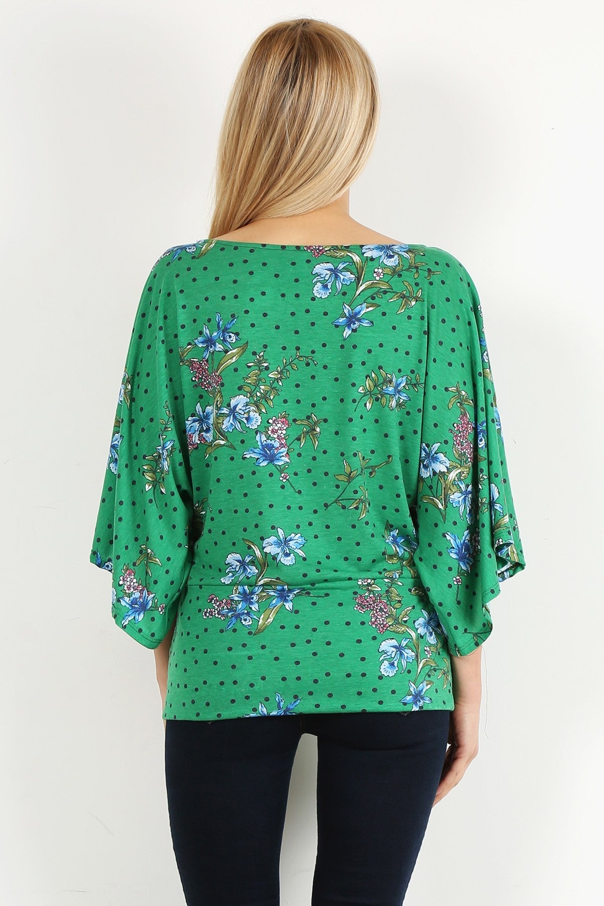 Green Floral Curvy Top with Bell Sleeves and Round Neckline, fitted at the hips.