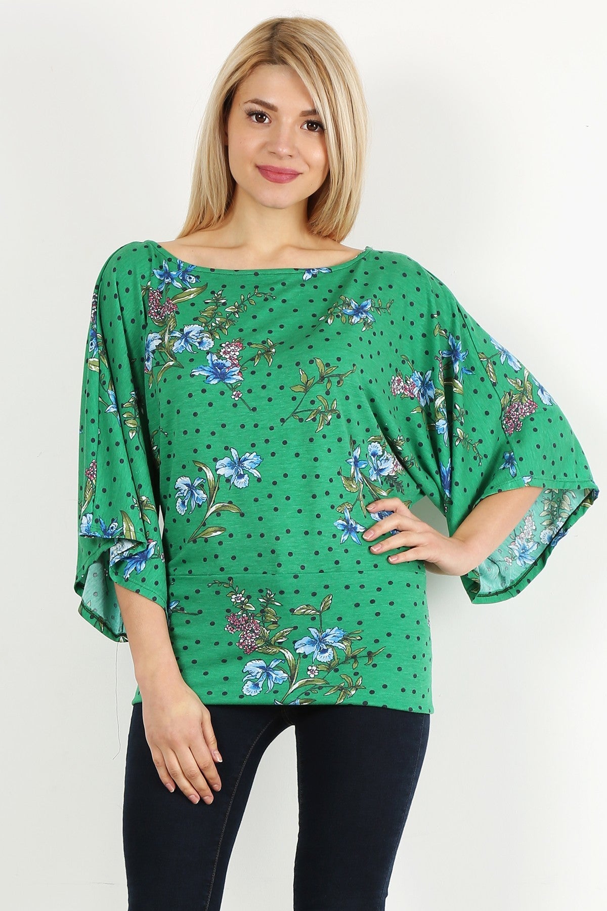 Green Floral Curvy Top with Bell Sleeves and Round Neckline, fitted at the hips.