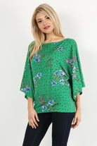 Green Floral Curvy Top with Bell Sleeves and Round Neckline, fitted at the hips.