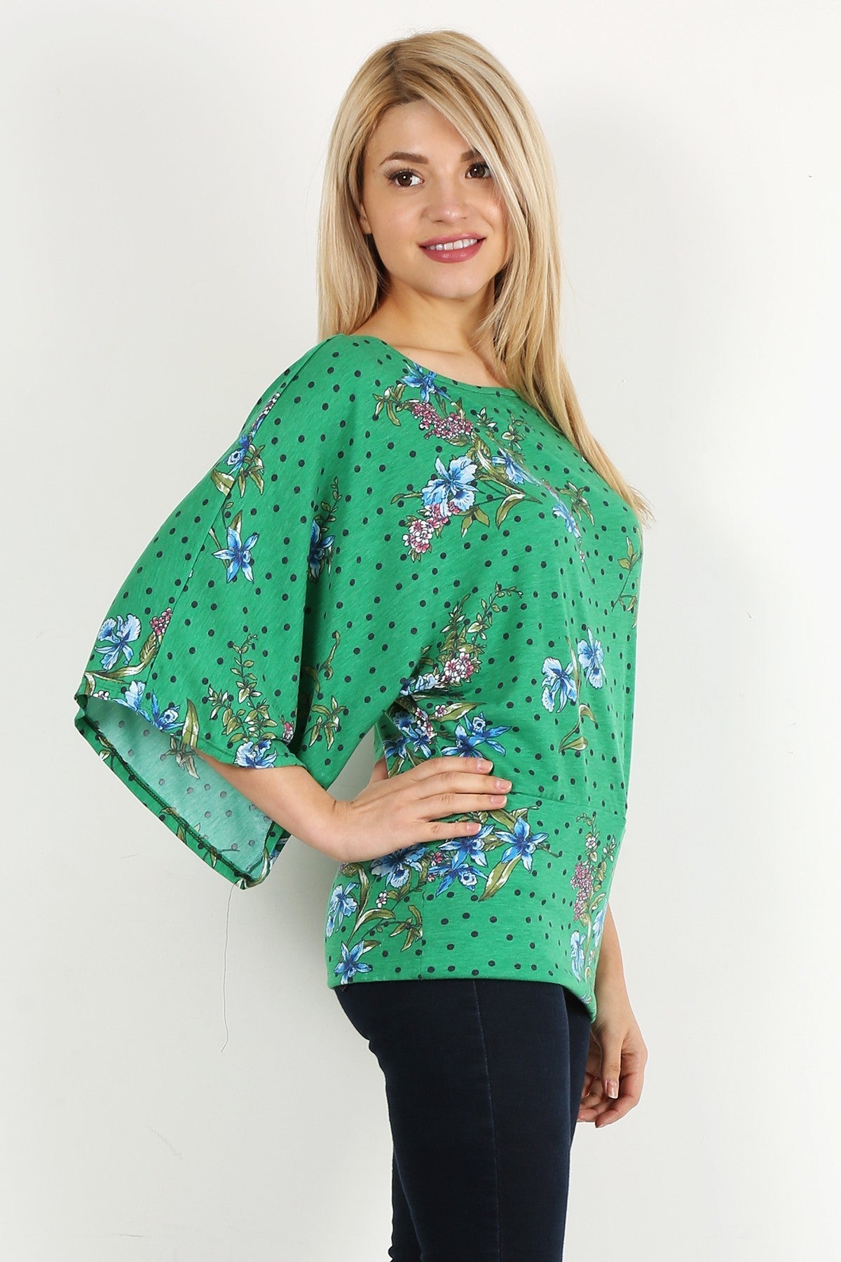 Green Floral Curvy Top with Bell Sleeves and Round Neckline, fitted at the hips.