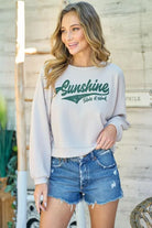 Sunshine State of Mind Taupe Long Sleeve Cropped Top

Graphic printed top with side slit